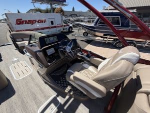 Luxury boat interior with captain's seat and dashboard at ASFB Marine.