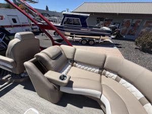 Luxury Bennington 25FT Q pontoon boat with seating and controls.