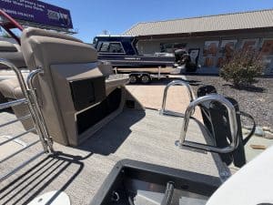 Bennington 25FT Q pontoon boat with seating and deck area.