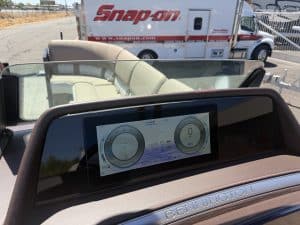 Close-up of Bennington 25FT Q boat dashboard with digital controls.
