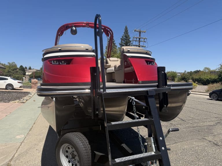 Red and black Bennington 25FT Q pontoon boat with ladder and seating.