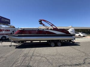 Bennington 25FT Q pontoon boat with 450HP engine on trailer.