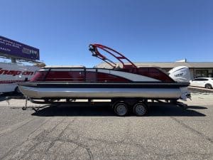 Bennington 25FT Q pontoon boat with 450HP engine on trailer.