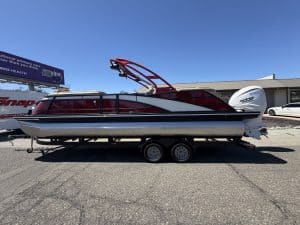Bennington 25FT Q pontoon boat with 450HP engine on trailer.
