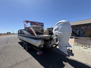 Bennington 25FT Q pontoon boat with Yamaha engine on trailer.