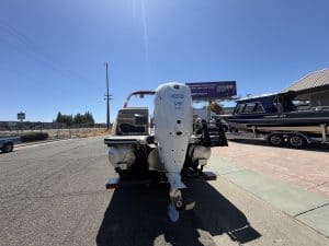 Bennington 25FT Q boat with 450HP outboard motor on trailer.