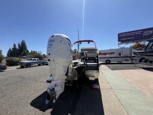 Bennington 25FT Q boat with Mercury 450HP outboard engine on trailer.