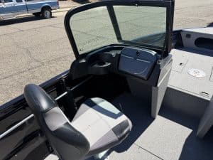 Interior view of Crestliner 1650 Kodiak fishing boat with steering console and seat.