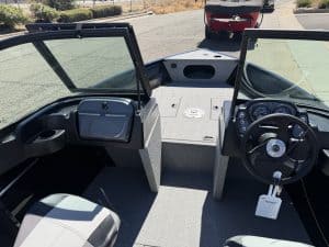 Interior view of Crestliner 1650 Kodiak fishing boat with steering and dashboard.