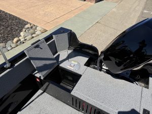 Storage compartments on Crestliner 1650 Kodiak fishing boat with outboard motor.