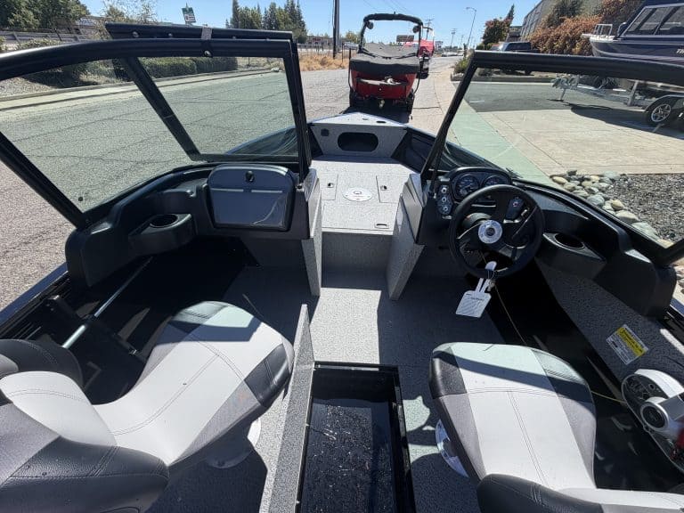 Interior view of Crestliner 1650 Kodiak fishing boat with steering and seating.