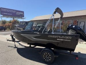 New Crestliner 1650 Kodiak fishing boat on trailer at dealership.