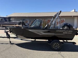 New Crestliner 1650 Kodiak fishing boat on trailer at dealership.