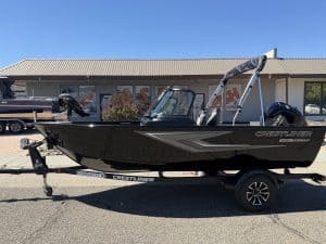 New Crestliner 1650 Kodiak fishing boat on trailer at dealership.