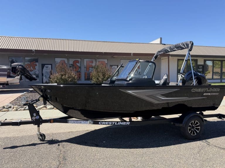 New Crestliner 1650 Kodiak fishing boat on trailer at dealership.
