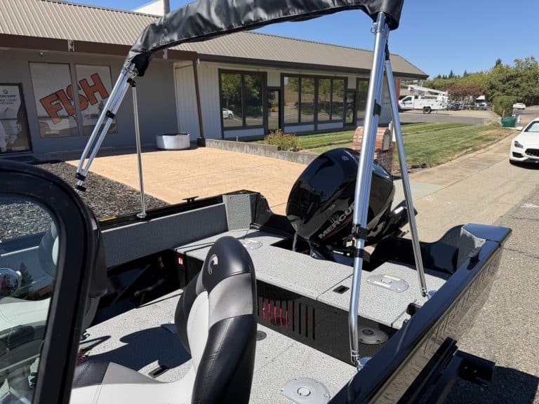 Interior view of the Crestliner 1650 Kodiak fishing boat with outboard motor.