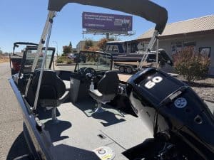 2027 Crestliner 1650 Kodiak fishing boat with outboard motor and canopy.