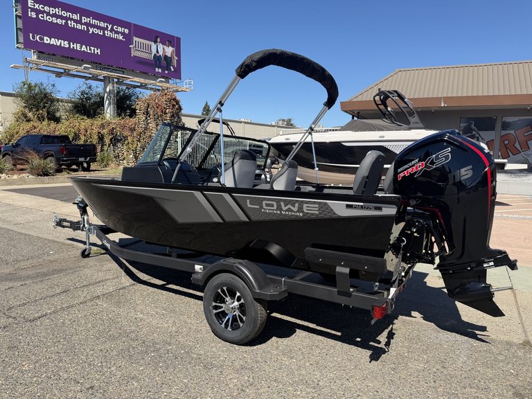 Lowe FM 1775 WT boat with Mercury 115HP outboard motor on trailer.