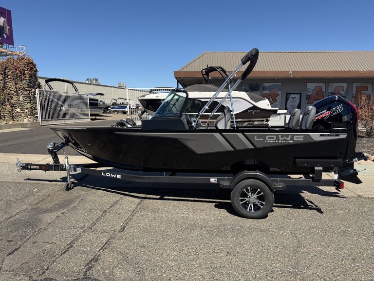 Lowe FM 1775 WT boat with Mercury 115HP outboard motor on trailer.