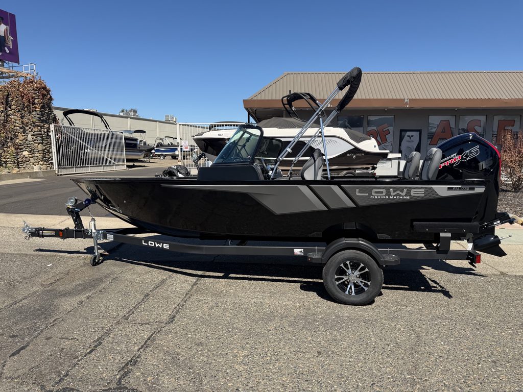 Lowe FM 1775 WT boat with Mercury 115HP outboard motor on trailer.