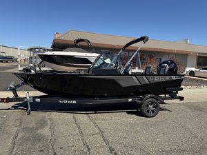 Lowe FM 1775 WT boat with Mercury 115HP engine on trailer.