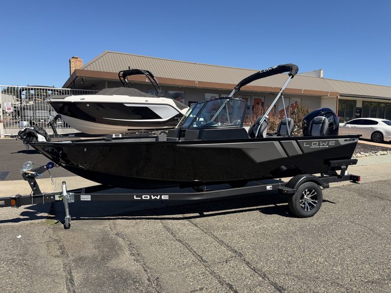 Lowe FM 1775 WT boat with Mercury 115HP Pro Xs engine on trailer.