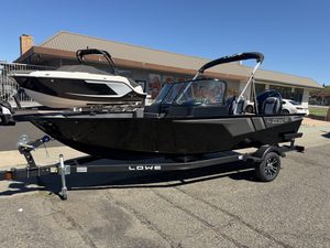 Lowe FM 1775 WT boat with Mercury 115HP engine on trailer.