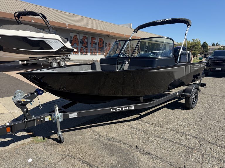 Lowe FM 1775 WT boat with Mercury 115HP engine on trailer.