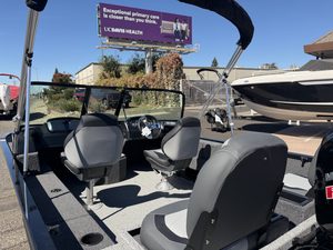 Lowe FM 1775 WT boat with Mercury 115HP engine on display.