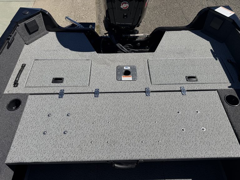 Fishing boat deck with storage compartments and Mercury 115HP Pro Xs engine.