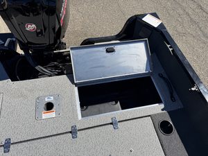 Boat storage compartment with lid open on Lowe FM 1775 WT boat.