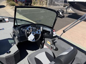 Boat console with steering wheel and controls at ASFB Marine.