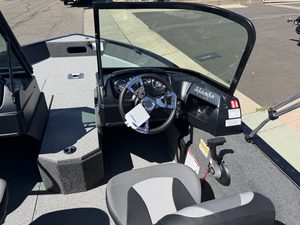 Boat cockpit with steering wheel and controls in Lowe FM 1775 WT.