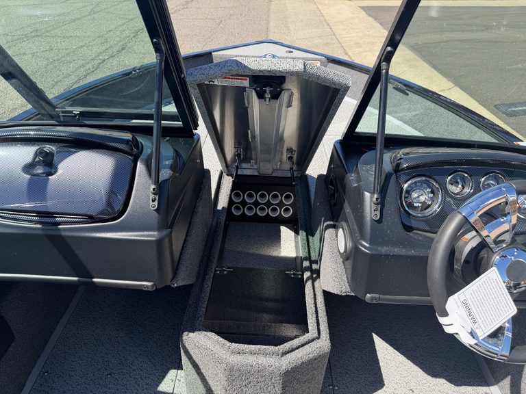 Boat dashboard with steering wheel and control panel at ASFB Marine.