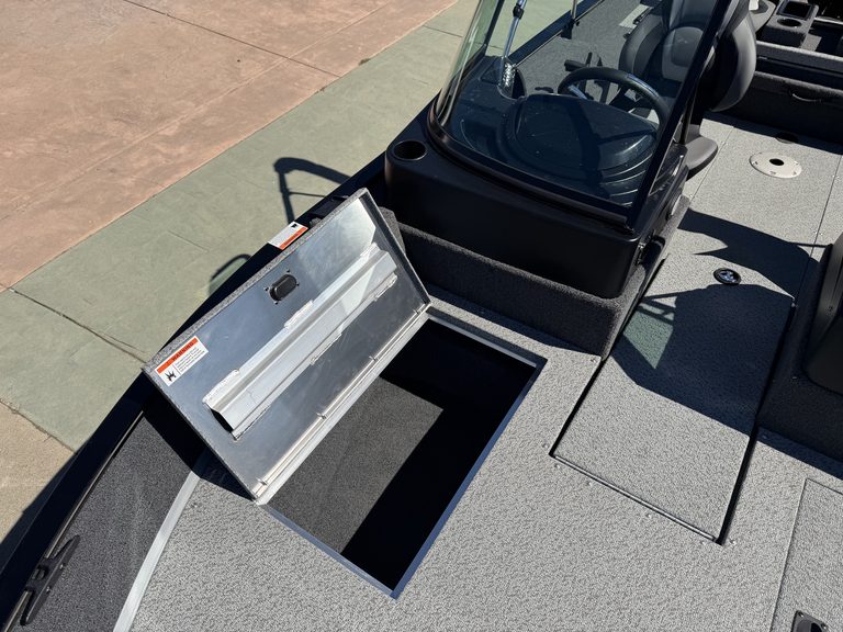 Lowe FM 1775 WT boat with open storage compartment and Mercury 115HP Pro Xs engine.