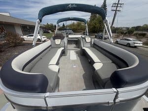 Luxury Avalon Cata pontoon boat with spacious seating and canopy for leisure.