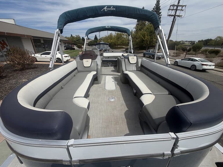 Luxury Avalon Cata pontoon boat with spacious seating and canopy for leisure.