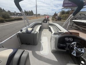 Luxury Avalon Cata pontoon boat with spacious seating and modern dashboard.