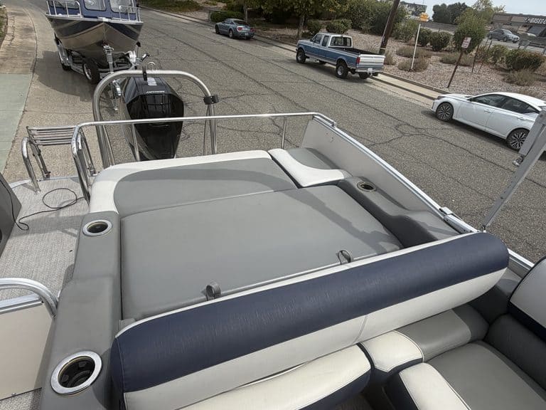 2022 Avalon Catalina pontoon boat with seating and outboard motor.