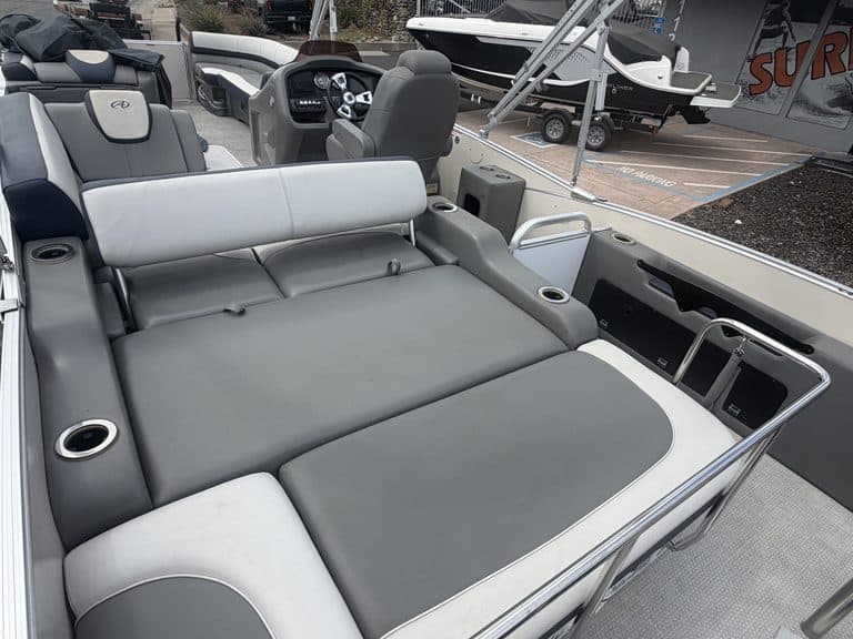 Luxury pontoon boat interior with spacious seating and modern controls.
