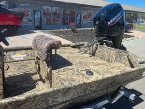 Camouflage jon boat with Mercury outboard motor at ASFB Marine.