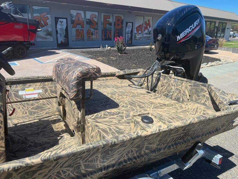 Camouflage jon boat with Mercury outboard motor at ASFB Marine.