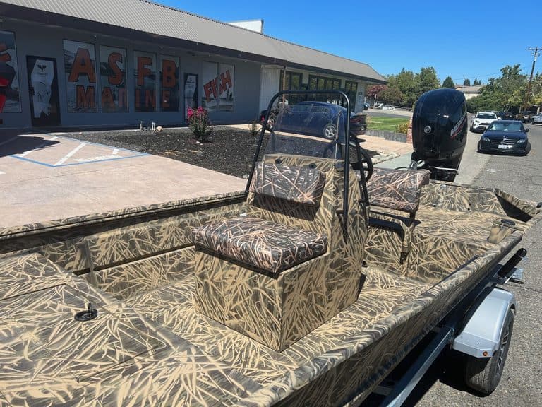 Camouflage Lowe RX 1860 boat with outboard motor at ASFB Marine.