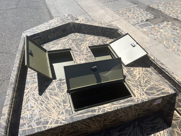 Camouflage boat storage box with multiple compartments on dock.