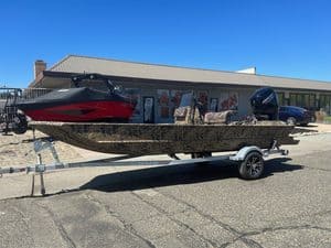 Lowe RX 1860 80HP jet boat on trailer outside ASFB Marine store.
