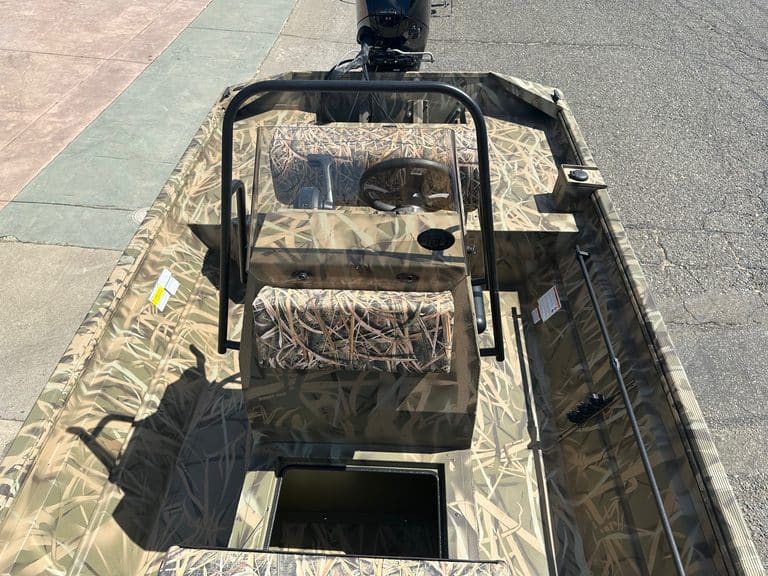 Lowe RX 1860 80HP Jet boat with camouflage pattern and outboard motor.