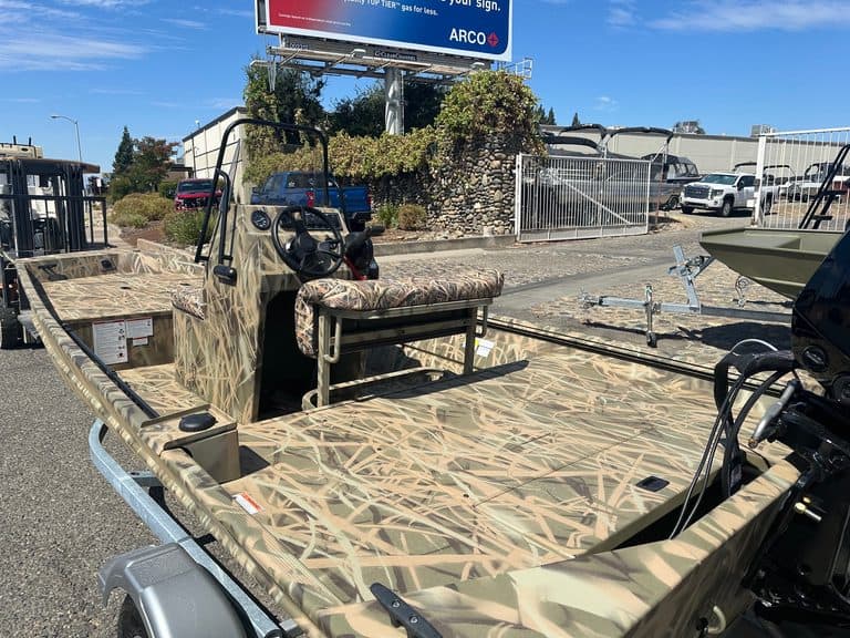 Camouflage Lowe RX 1860 jet boat with 80HP engine on display.