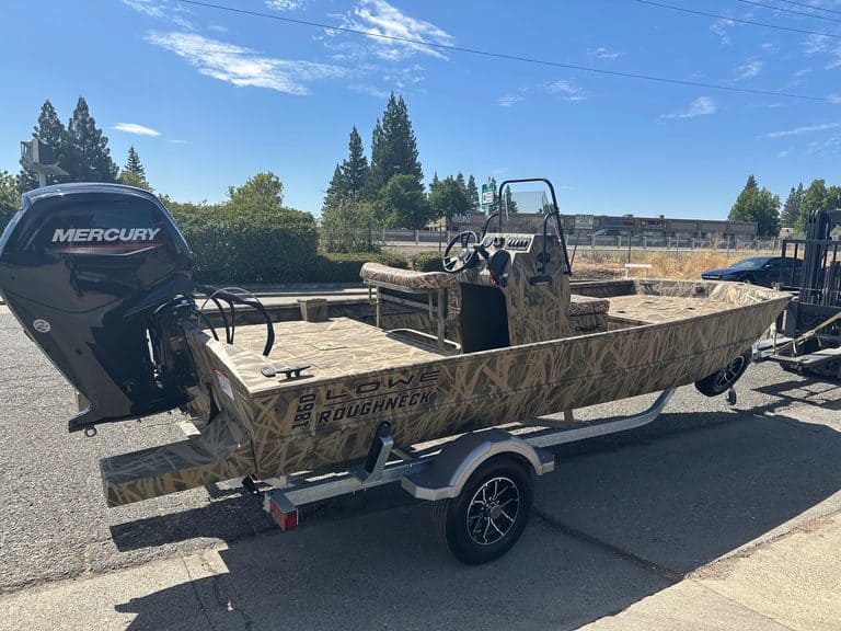 Lowe RX 1860 boat with Mercury outboard motor on trailer.