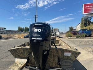 Lowe RX 1860 boat with Mercury 80HP jet engine on display.