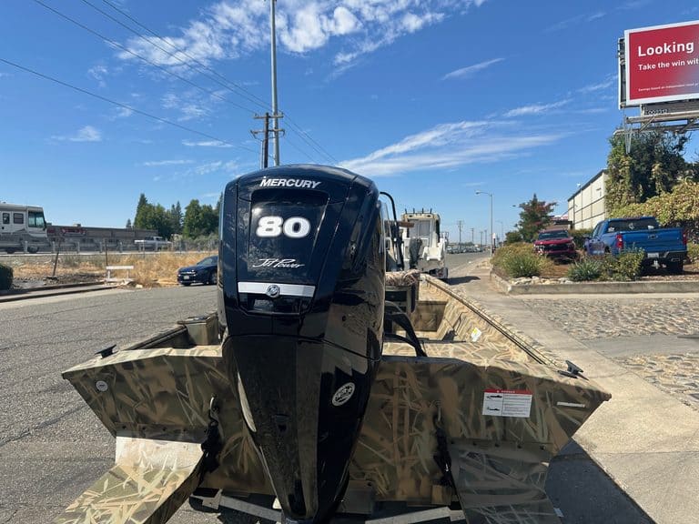 Lowe RX 1860 boat with Mercury 80HP jet engine on display.